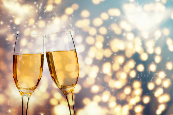 Champagne glasses on sparkling background - 写真・画像