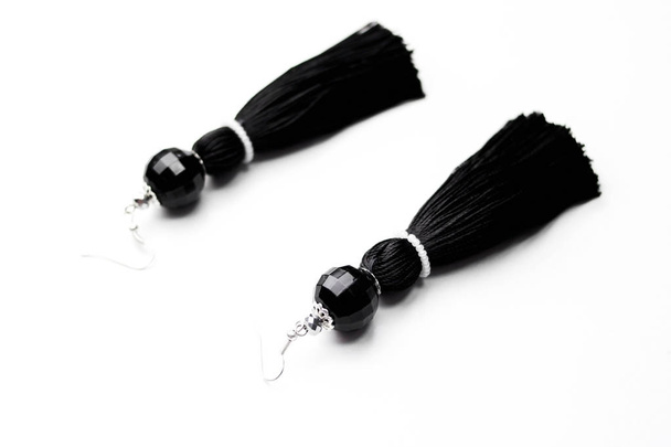 Luxury earrings in black on white - Foto, imagen