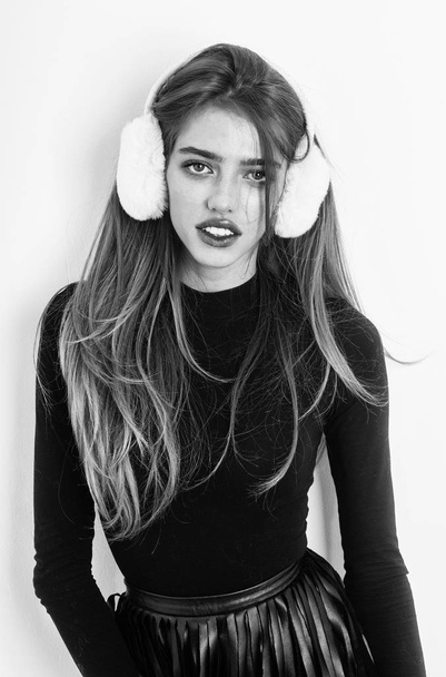 Pretty girl with long hair in earmuffs - Valokuva, kuva