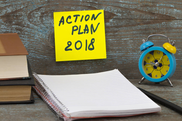 Action Plan 2018 Inscription written on sticky note. Books, pen, - Photo, Image