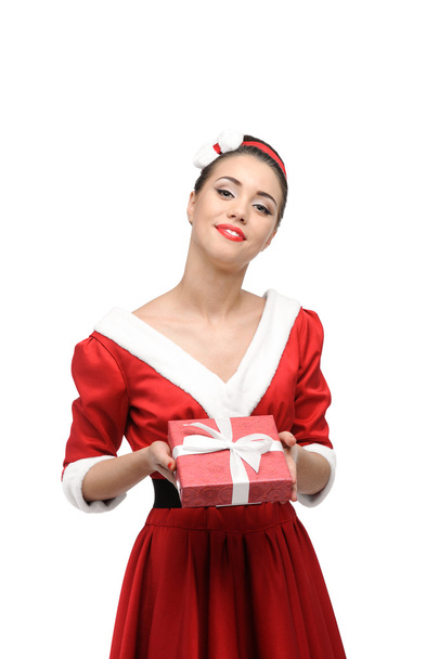 Cheerful retro girl holding christmas gift - Фото, изображение