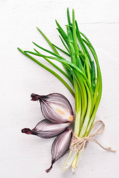 Onion on a wooden background. Top view. Free space for your text. - Photo, Image