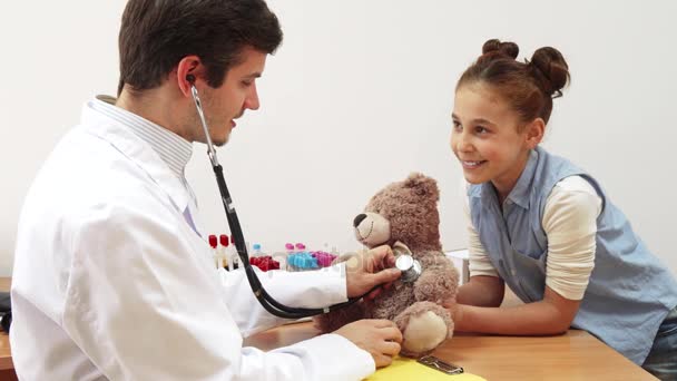 A little girl took her teddy bear to a doctors appointment. - Footage, Video