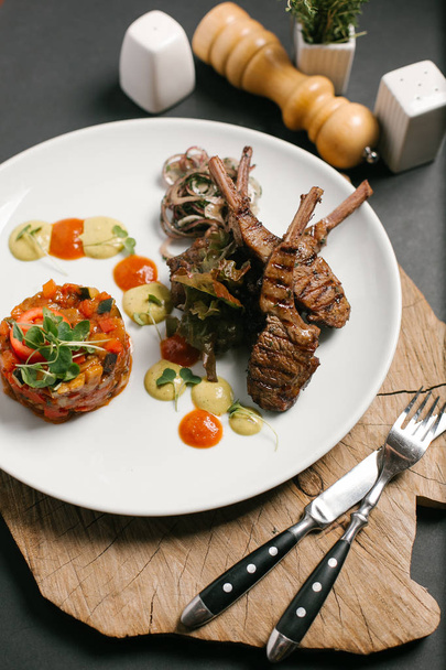 Lamb chops served with vegetable curry and two kinds of sauce - Photo, Image