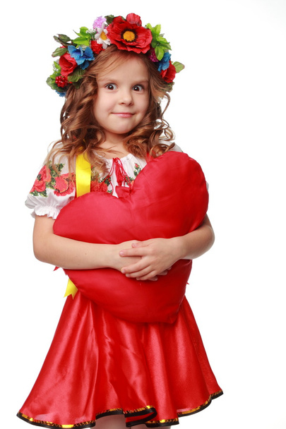 Image of cute little girl dressed in traditional Ukrainian on Valentine Day - Фото, изображение