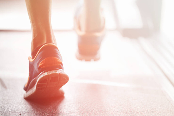 Athletic Runner Running on Treadmill in Gym - Fotó, kép