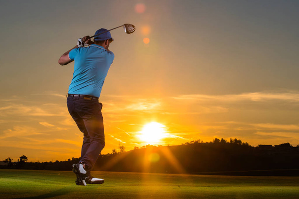 Man is playing golf during sunset - 写真・画像