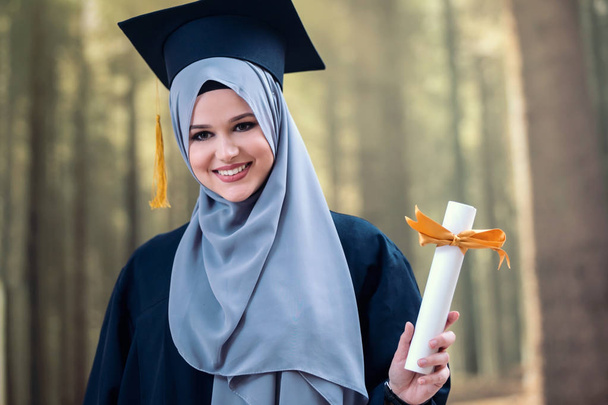Pretty  female graduate student wearing hijab - Фото, зображення
