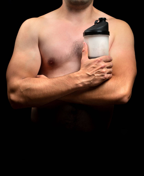 Sports nutrition in hands bodybuilder - Photo, Image