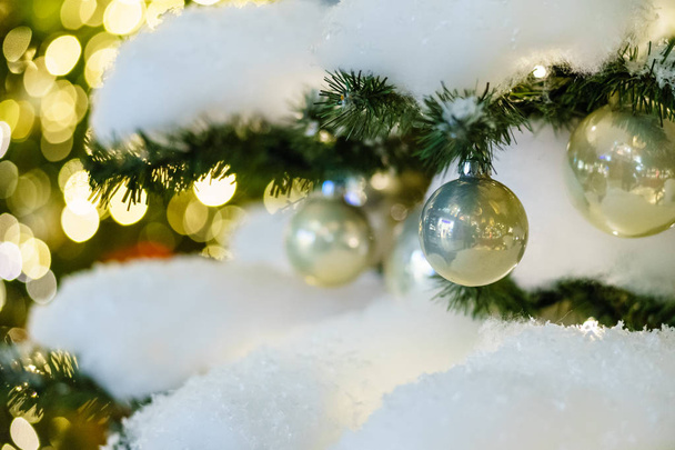 Christmas balls on a Christmas tree. Focus on the foreground. - Foto, afbeelding