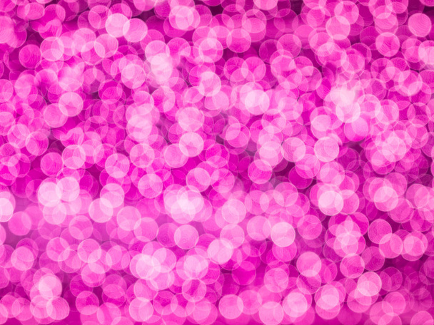 roze wazig bokeh licht intreepupil achtergrond en ribbels en noppen voor valaentine, Kerstmis, Nieuwjaar, feestdagen en viering achtergrond - Foto, afbeelding