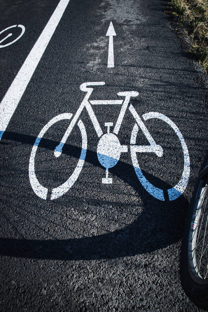 shadow bicycle wheel on the road - Photo, Image