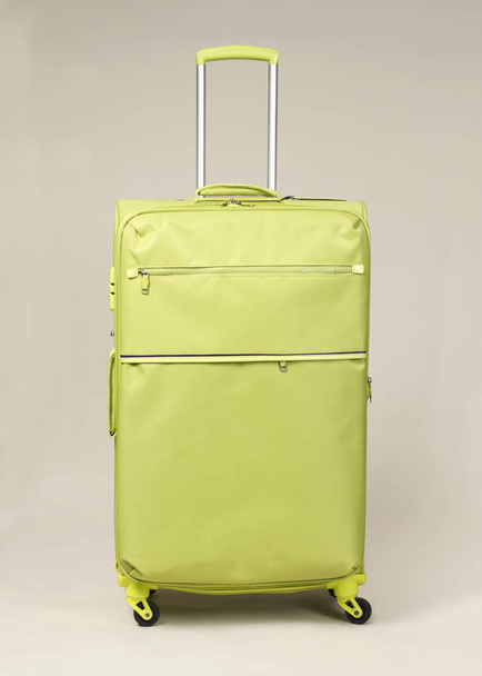 Yellow Fabric modern suitcase - 写真・画像
