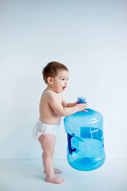 Baby with a water bottle - Fotó, kép