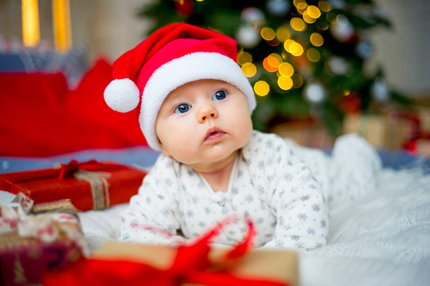 Baby in a christmas hat - Фото, изображение