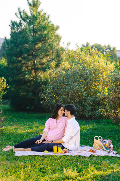 Happy couple having a healthy picnic on nature - Φωτογραφία, εικόνα
