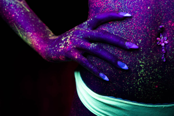 Closeup woman stomach with fluorescent make up, creative makeup look great for nightclubs. Halloween party, shows and music concept - Fotoğraf, Görsel