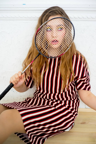 Girl with a badminton racket - Foto, Imagen
