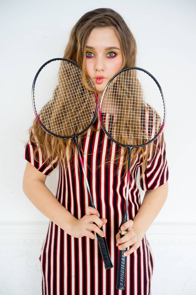 Girl with a badminton racket - Foto, Imagen