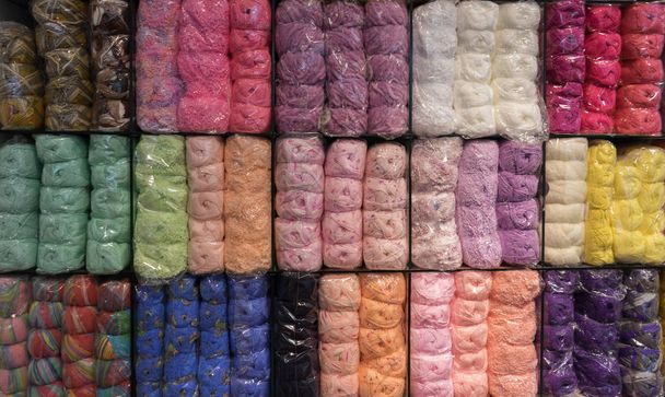Colorful of yarns ball arranged on shelf. - Photo, Image