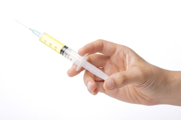 Syringe in hand isolated on white background - Zdjęcie, obraz
