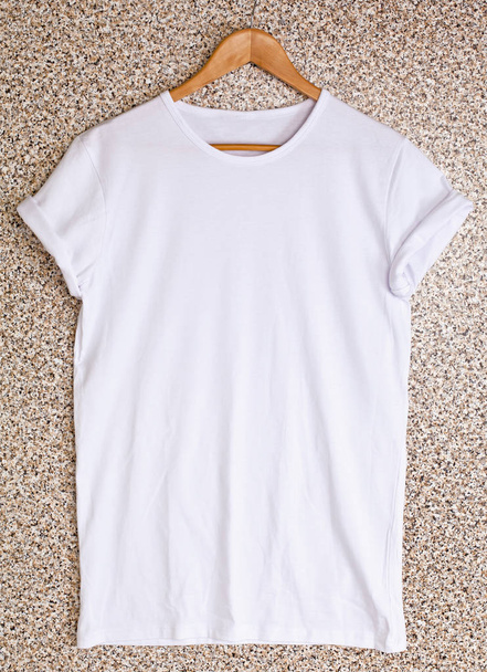 White t-shirt template on hanger ready for your own design. - Fotó, kép