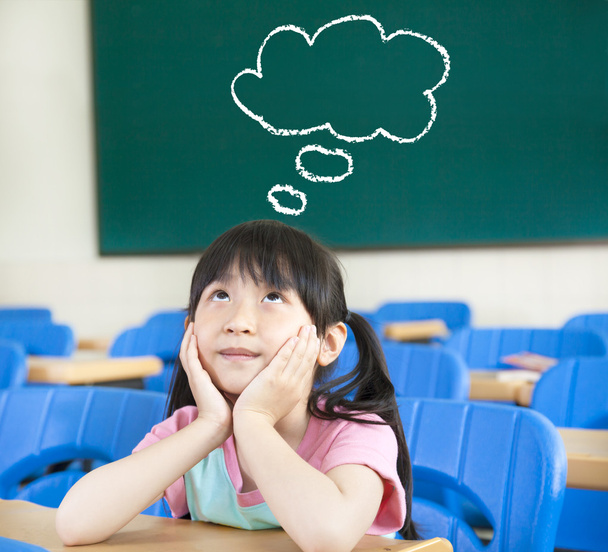 Little girl in the classroom with thinking cloud symbol - Photo, Image