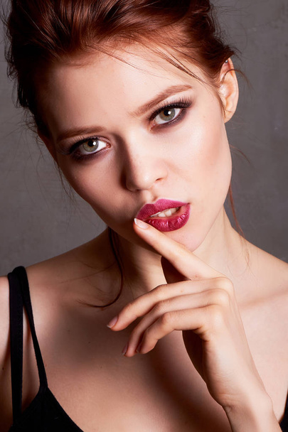 portrait of a beautiful red-haired girl.Close. Plump lips. - Valokuva, kuva