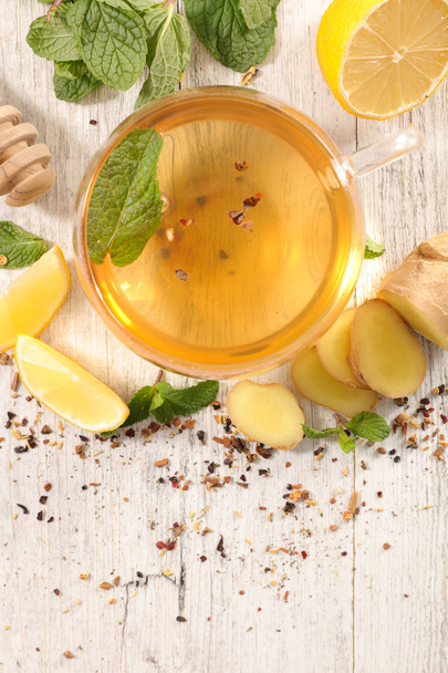 lemon tea with ginger on wooden table  - Φωτογραφία, εικόνα