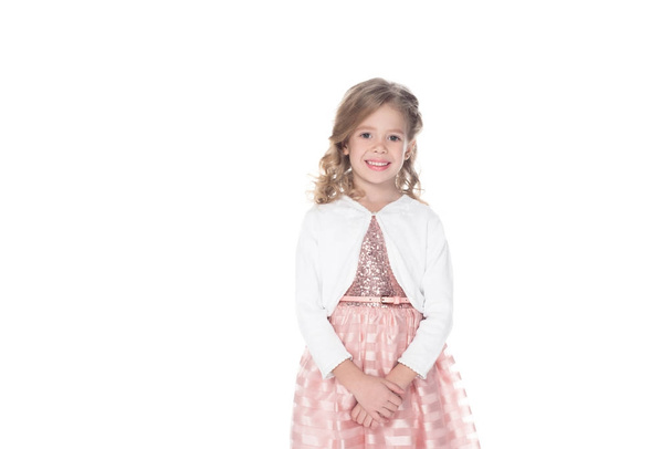 śliczny uśmiechający się dziecko w różowej sukience, na białym tle  - Zdjęcie, obraz