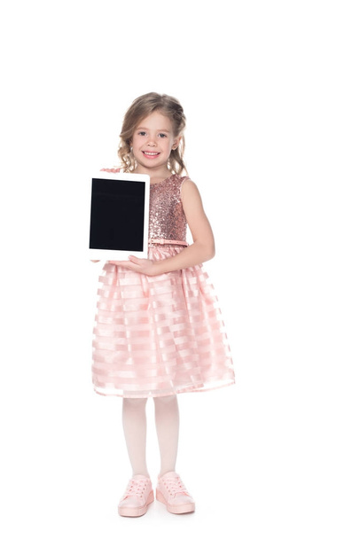 adorable kid presenting digital tablet with blank screen, isolated on white - Valokuva, kuva