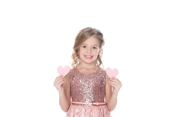 beautiful smiling kid holding two hearts, isolated on white - Fotoğraf, Görsel