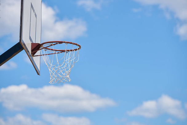 Basketball hoop in sunlight and sky / for goal concept - Foto, Imagem