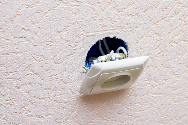 Old broken electrical socket fell out of wall - Zdjęcie, obraz