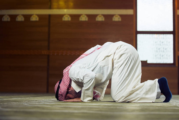 Religious muslim man praying inside the mosque - 写真・画像