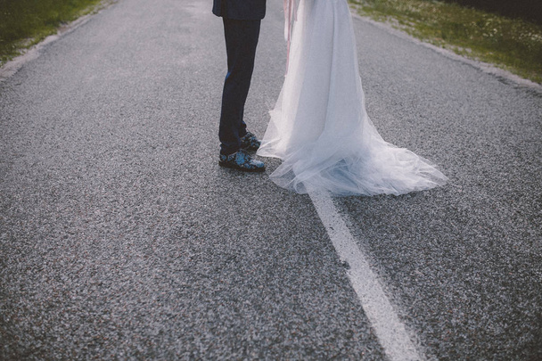 Cropped view of married on countryside road - Φωτογραφία, εικόνα
