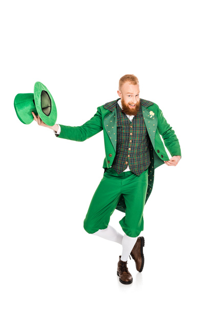 handsome leprechaun in green costume holding hat, isolated on white - Photo, Image