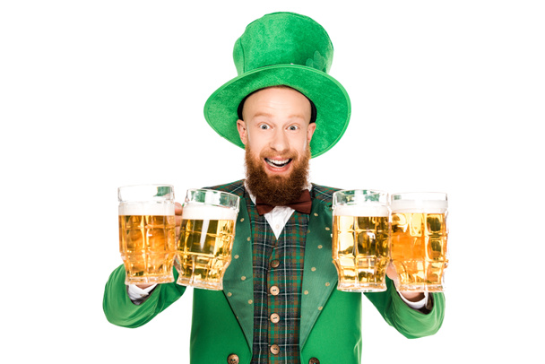 excited leprechaun celebrating st patricks day with glasses of beer, isolated on white - Photo, Image