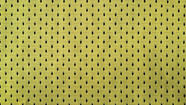 Close up de amarelo poliéster nylon amarelo sportswear shorts para criar um fundo texturizado
 - Foto, Imagem