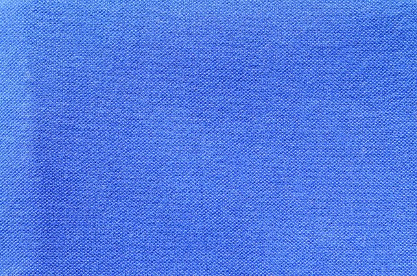 Blauwe sport jersey shirt kleding textuur en achtergrond - Foto, afbeelding