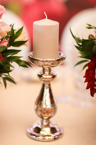 Candle on the white table. Wedding banquet - Fotó, kép