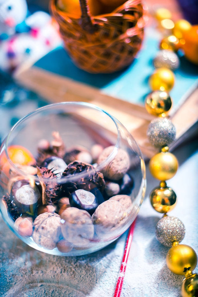 Nuts in a glass jar on a blurred background. - Фото, зображення