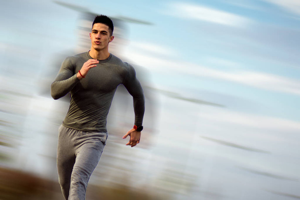 running handsome sportsman - Photo, Image