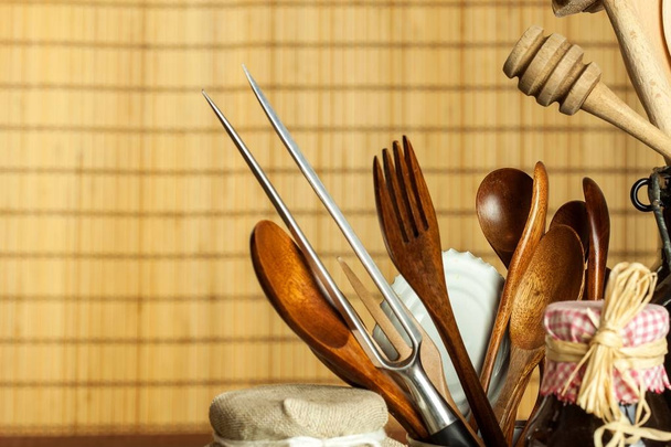 Kitchen tools on the table. Utensils for chefs. Old wooden spoon. - Photo, image