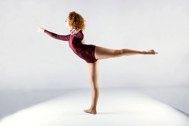 Beautiful young professional dancer dancing over white backgroun - Photo, Image