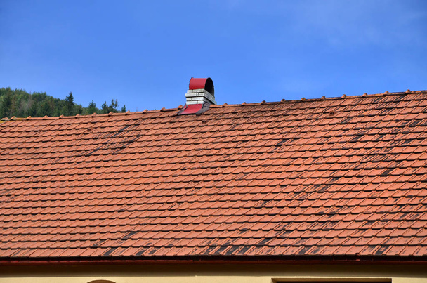 The roof of this square ceramic tile is red. The old type of roof covering in rich houses of the 19th century - Photo, Image