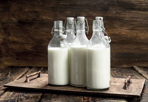 Bottles with fresh milk. - Foto, imagen