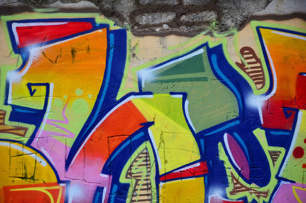 Some elements of a large and composite graffiti pattern on the wall, made with different colors of aerosol paints - Φωτογραφία, εικόνα