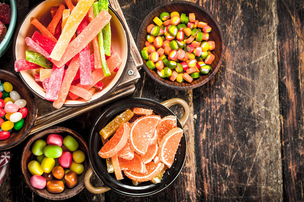 Different sweet candy, jelly, marshmallows and candied fruits. - Fotografie, Obrázek