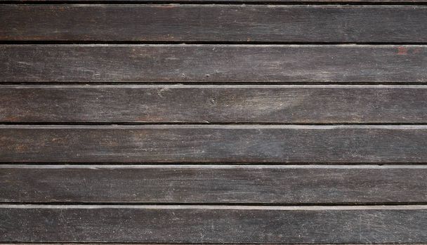 The texture of weathered wooden wall. Aged wooden plank fence of horizontal flat boards - Foto, Imagem